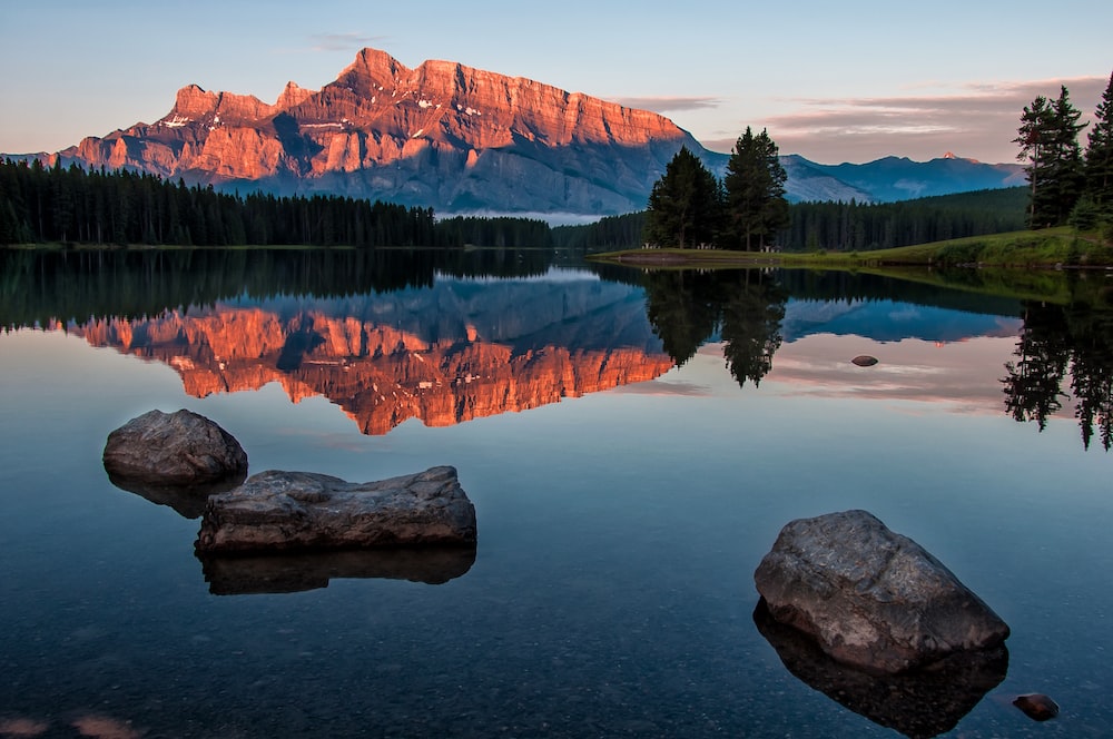 peaceful lake and mountains in the background.